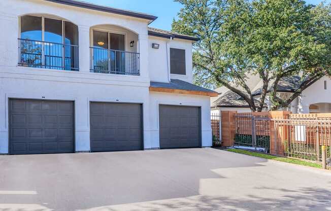 a house with a garage with three garage doors