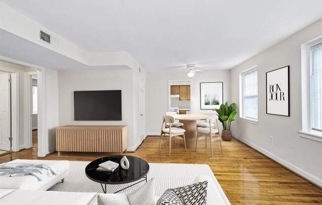 a living room with a couch and a table and a tv