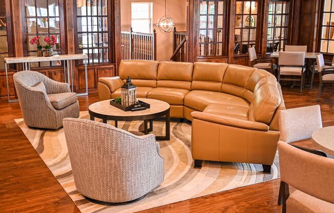 a living room filled with furniture and a rug