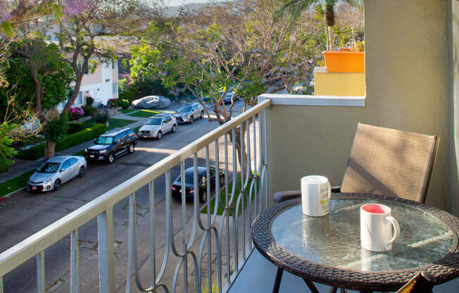 Apartment balcony with street and treetop views