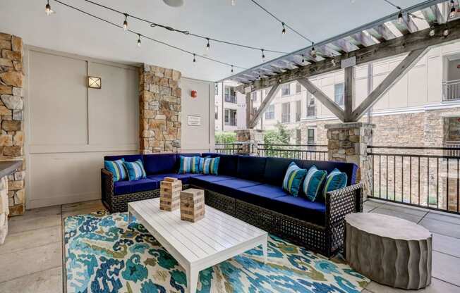 Outdoor terrace lounge overlooking pool at Berkshire Dilworth apartments