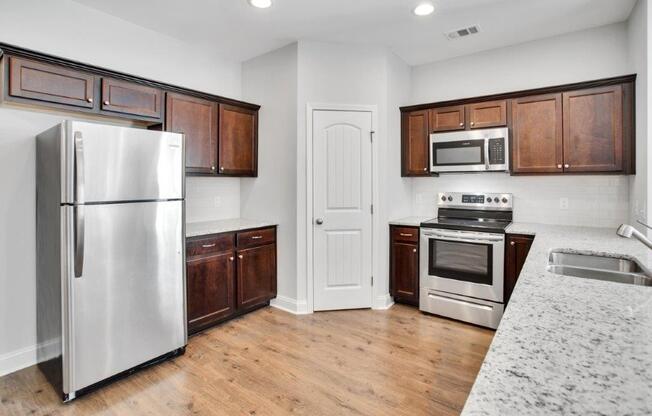 Harris Trail Luxury Townhomes for rent Richmond Hill, GA photo of kitchen with pantry and exspresso cabinets