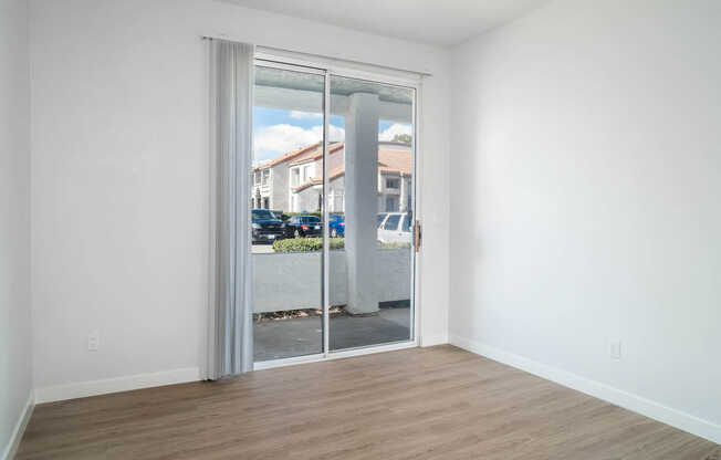 Bedroom with Balcony and Hard Surface Flooring