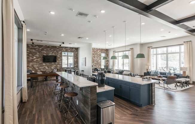 a large kitchen with a bar and a living room at Village at Westland Cove Apartments, Knoxville