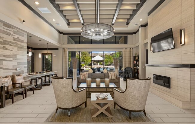 a living room with a table and chairs and a fireplace