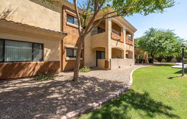 A building with a tree in front of it.