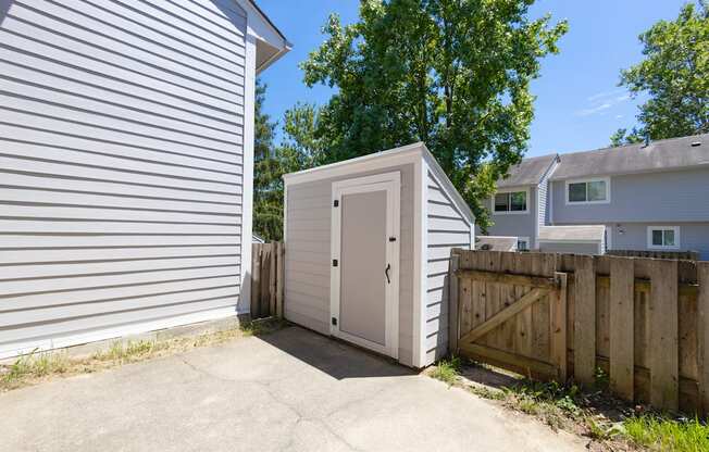 Enclosed Patio with Additional Storage in the Three Bedroom Townhome at Woodbridge Apartments Bloomington