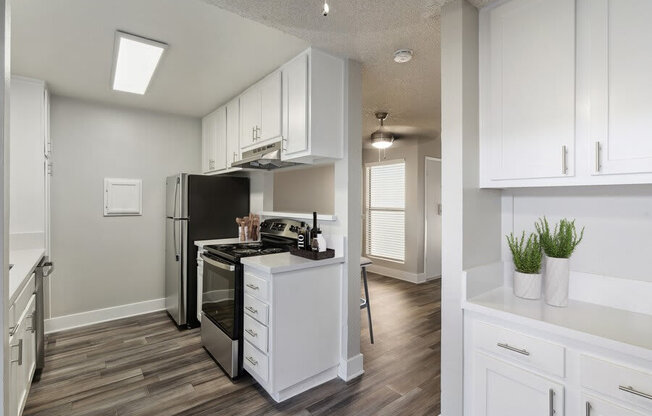 Model kitchen with white cabinetry