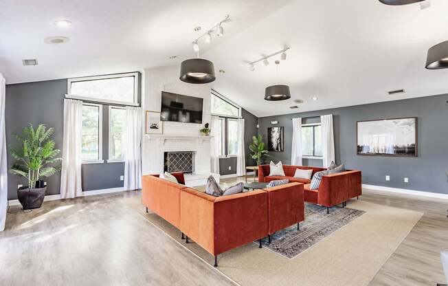 A modern living room with a fireplace and a large couch