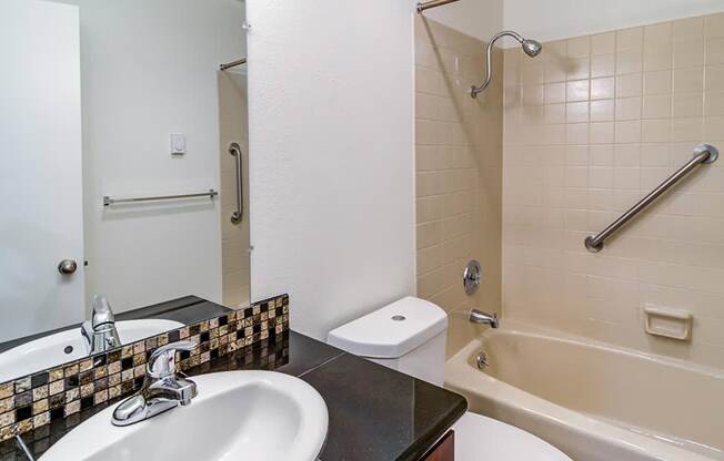 a bathroom with a sink toilet and bathtub at The Bluffs at Mountain Park, Lake Oswego, OR