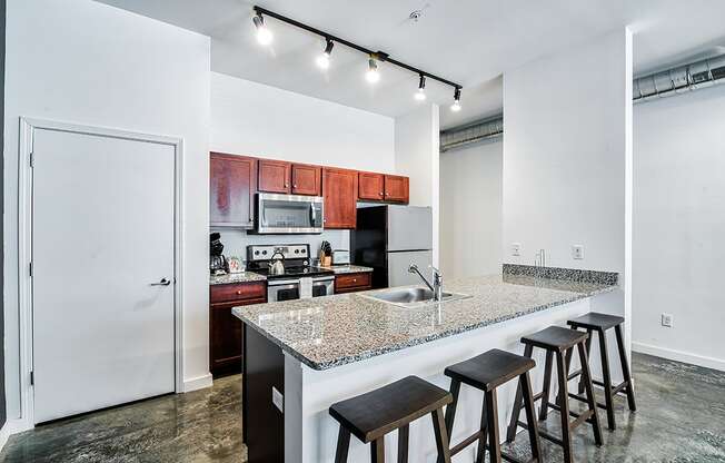 kitchen with an island with granite countertops