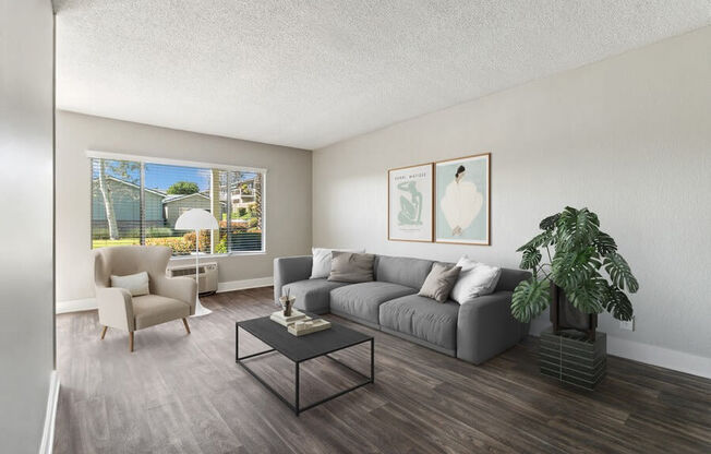 Model Living Room with Wood-Style Flooring & Window View at Forest Park Apartments in El Cajon, CA.