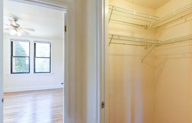 large closet with view of living area at the klingle apartments in washignton dc