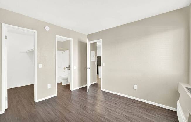 A room with three mirrors on the wall.