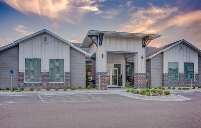 an empty parking lot in front of a building  at Affinity 56 Apartments in West Jordan, Utah