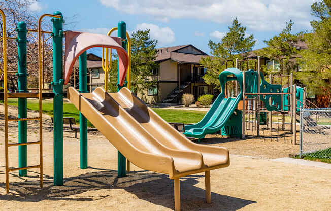 a playground with a slide and other playground equipment
