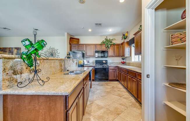 a kitchen with wooden cabinets and granite counter tops