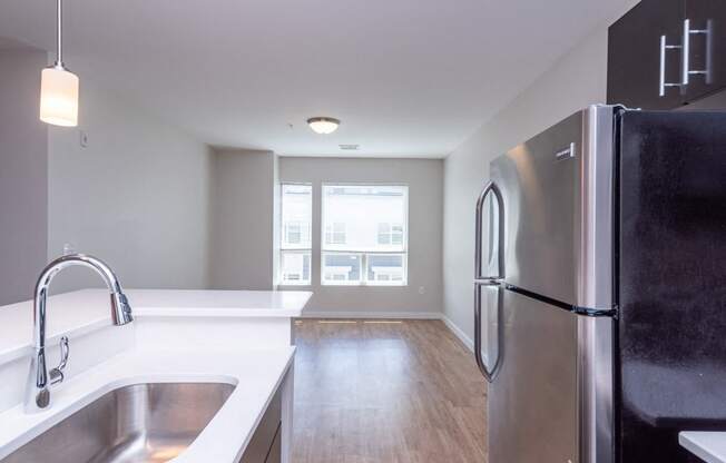 apartment kitchen and stainless steel refridgerator