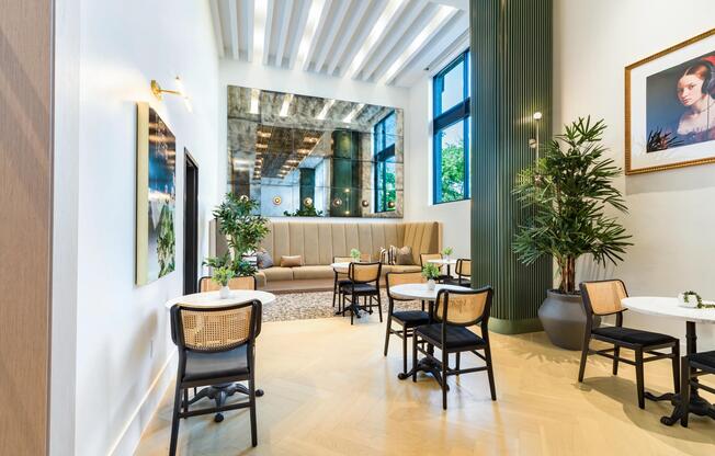 Community seating lounge with café tables, banquettes, and natural light offering a relaxed place to gather near Nashville’s growing neighborhoods.