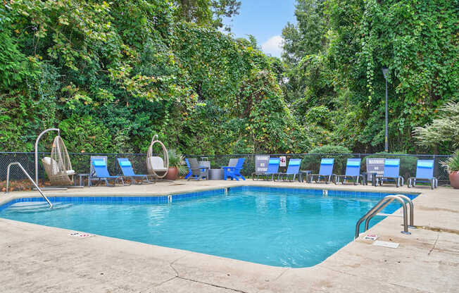 Pool With Relaxing Chairs at Lofts of Wilmington, North Carolina, 28405