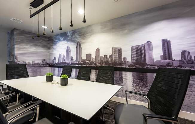 a meeting room with a large mural of a city on the wall