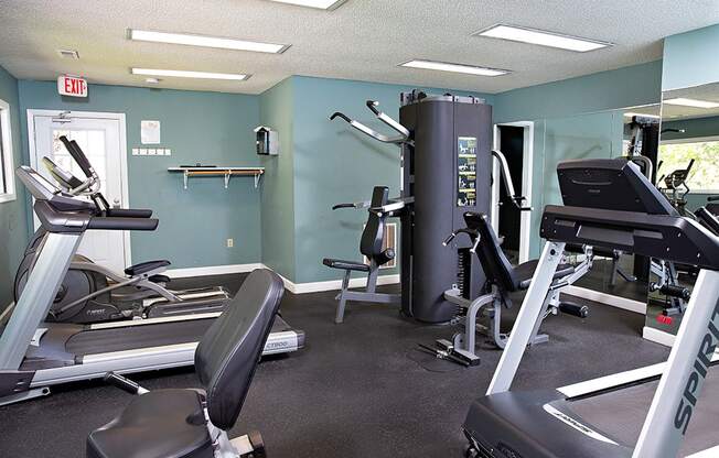 a gym with various exercise machines and weights