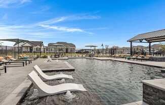 Resort-style pool and lounging at Avilla Oakridge in Forney, TX.
