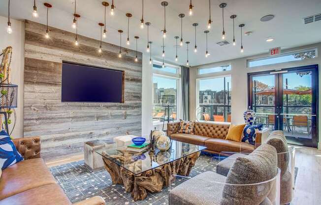 Resident entertainment lounge at the clubhouse at Midway Urban Village Luxury Townhomes and loft apartments in Farmers Branch, Texas near North Dallas. Luxury North Dallas Townhomes for rent