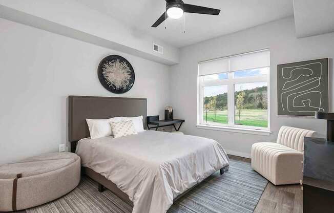 Bedrooms with overhead lighting and ceiling fan