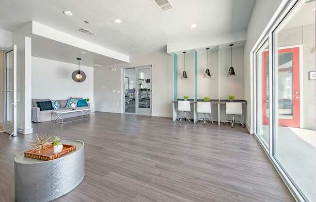 a resident clubhouse with gray flooring and white walls