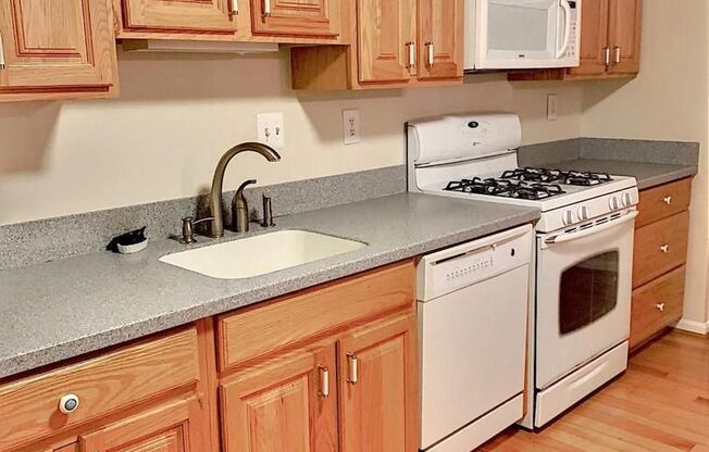 Welcome to this beautifully maintained brick end residence in the heart of Falls Church, where comfort, style, and convenience come together.