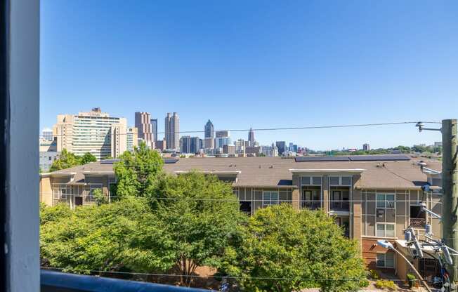 the view of the city skyline from a balcony