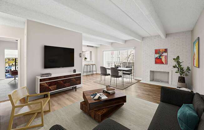 A living room with a fireplace and a television.