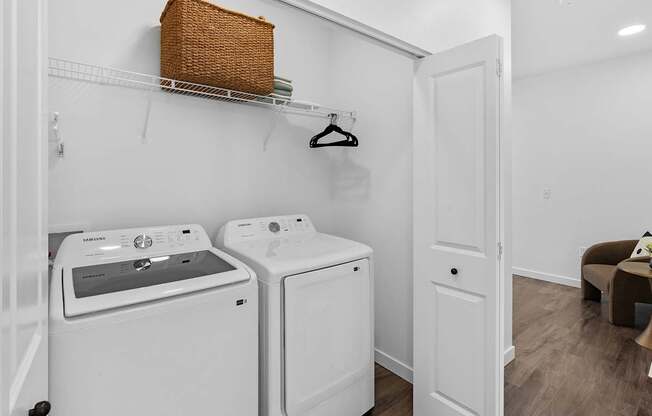 A laundry room with a washer and dryer.