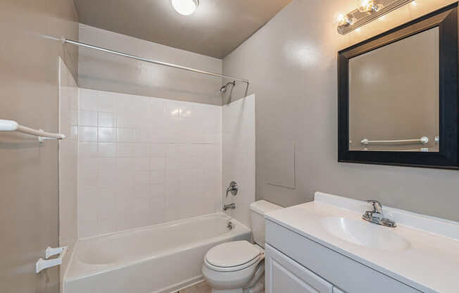 a bathroom with a sink toilet and a bath tub