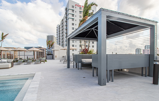 Poolside cabana seating with sweeping views of Miami