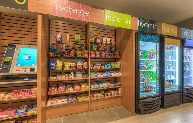 a refrigerated section of the store with a vending machine next to it