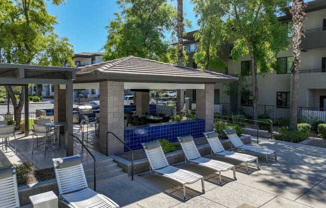 poolside lounging areas at Avora apartments