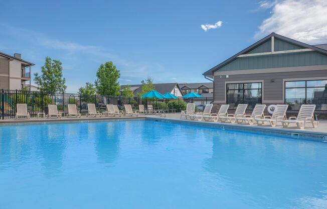 a large pool of water in front of a house