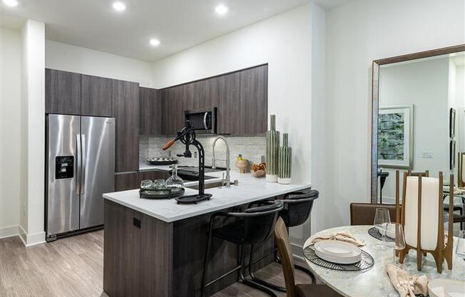 Kitchen with dining and cabinets at Kinley West LA, Los Angeles, CA
