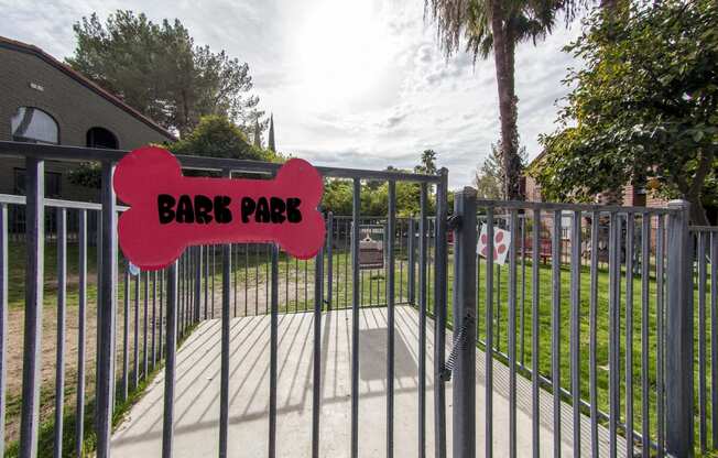 a gate with a sign that reads barbs park