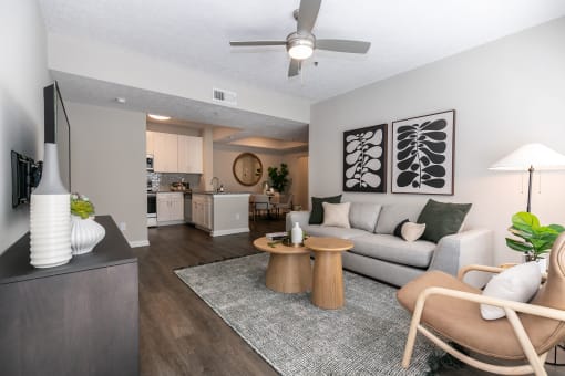 an open living room and kitchen with a couch and a table