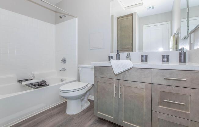 a room with a sink and a mirror