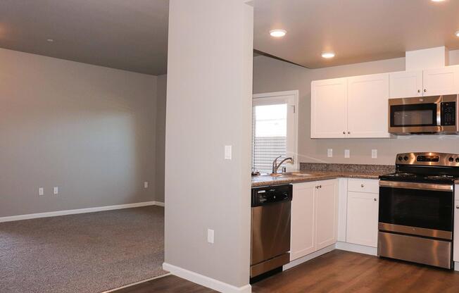 a kitchen with a stove and a refrigerator