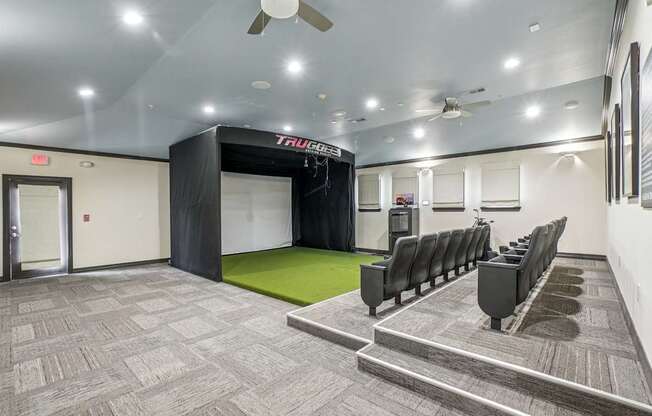 A room with a row of chairs and a TRUCKS sign on the wall.