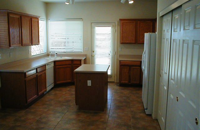 Wonderful Summerlin single story with grass backyard and island kitchen.