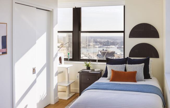 Studio unit with a bed and a window with a city view at Book Tower, Michigan, 48226