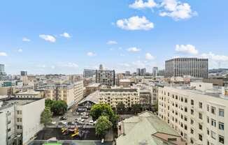 the view of the city from the roof of a building