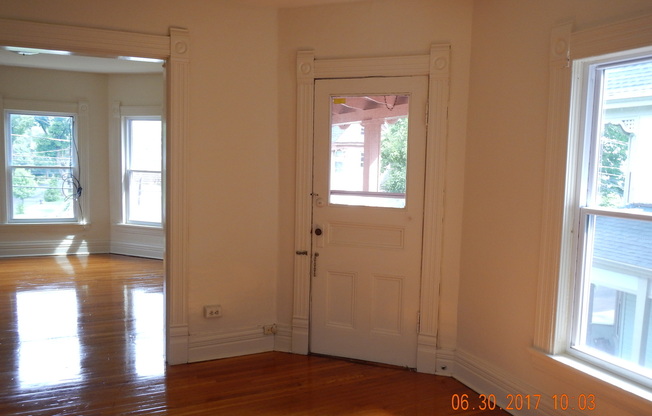 AVAILABLE 7/1/25 - Charming Second Floor Apartment One Block From Shops, Eateries and Bus lines