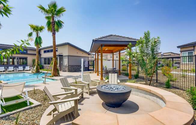 our apartments have a pool and lounge area with chairs and a fire pit at Grandstone at Sunrise, Peoria, 85383